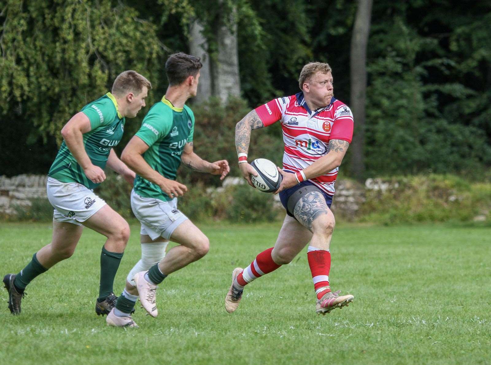 Lewis Scott looks to pass ball to support. Picture: John MacGregor