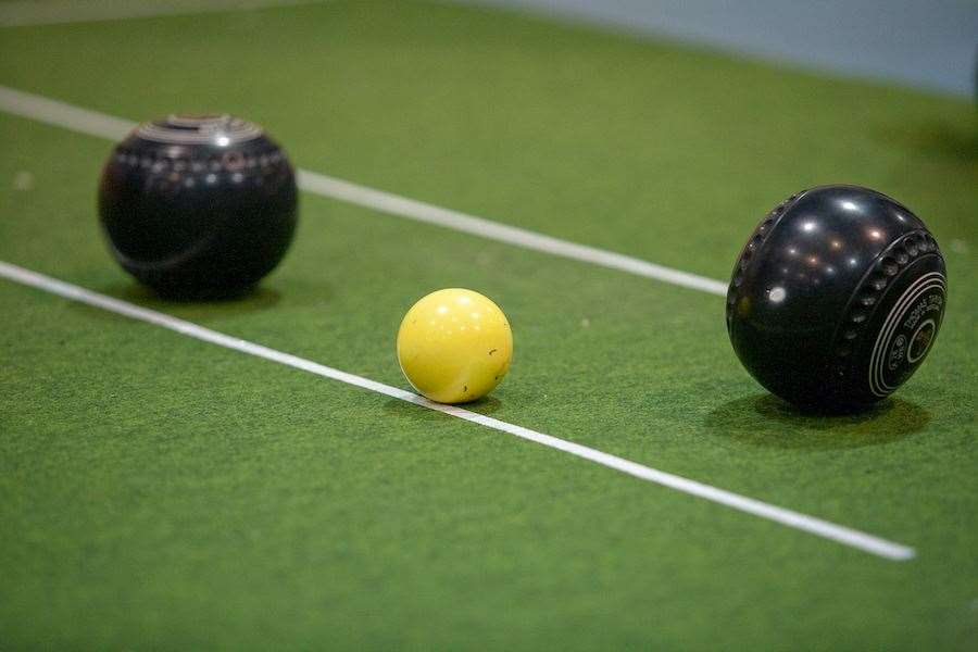 Action from the indoor bowls scene.
