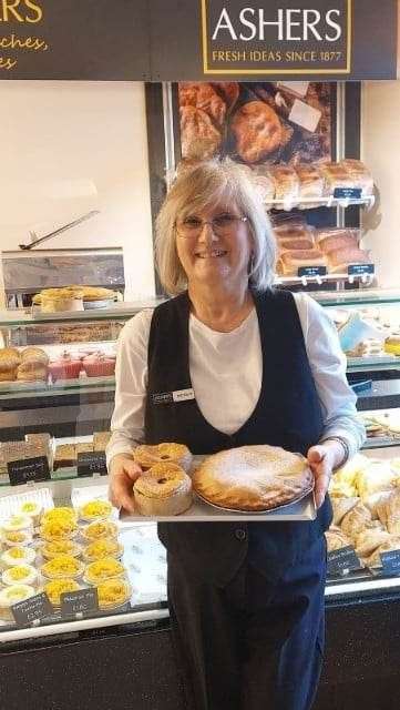 Ashers Forres shop assistant Michele Worth with a few of their prize winning pies.