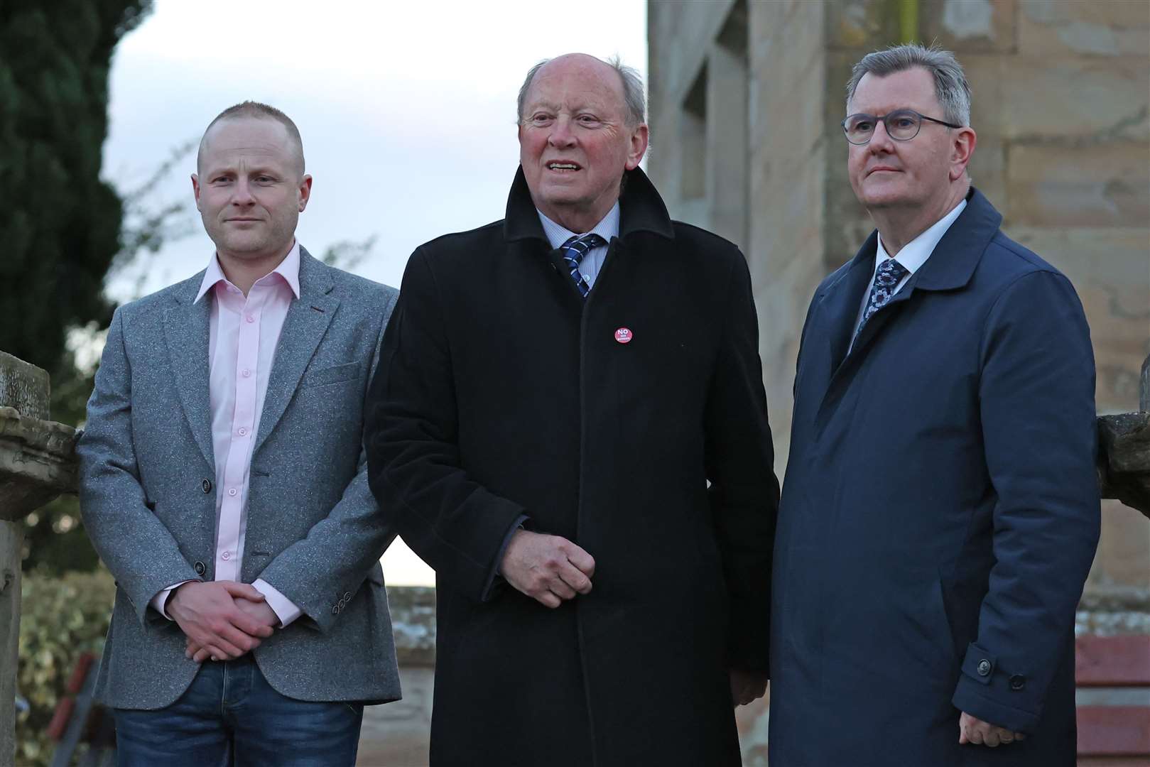 (l to r) Jamie Bryson, Jim Allister and DUP leader Sir Jeffrey Donaldson attend a rally in opposition to the Northern Ireland Protocol in Lurgan, County Armagh in 2022 (Liam McBurney/PA)
