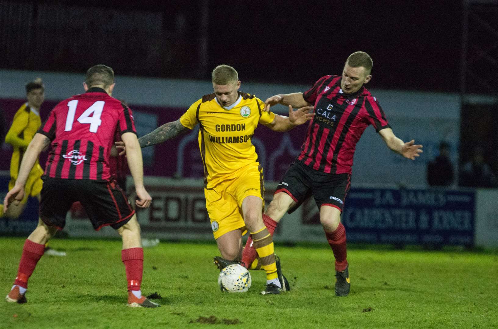 Inverurie Locos defender Eric Watson tries to stop Lee Fraser. Picture: Becky Saunderson