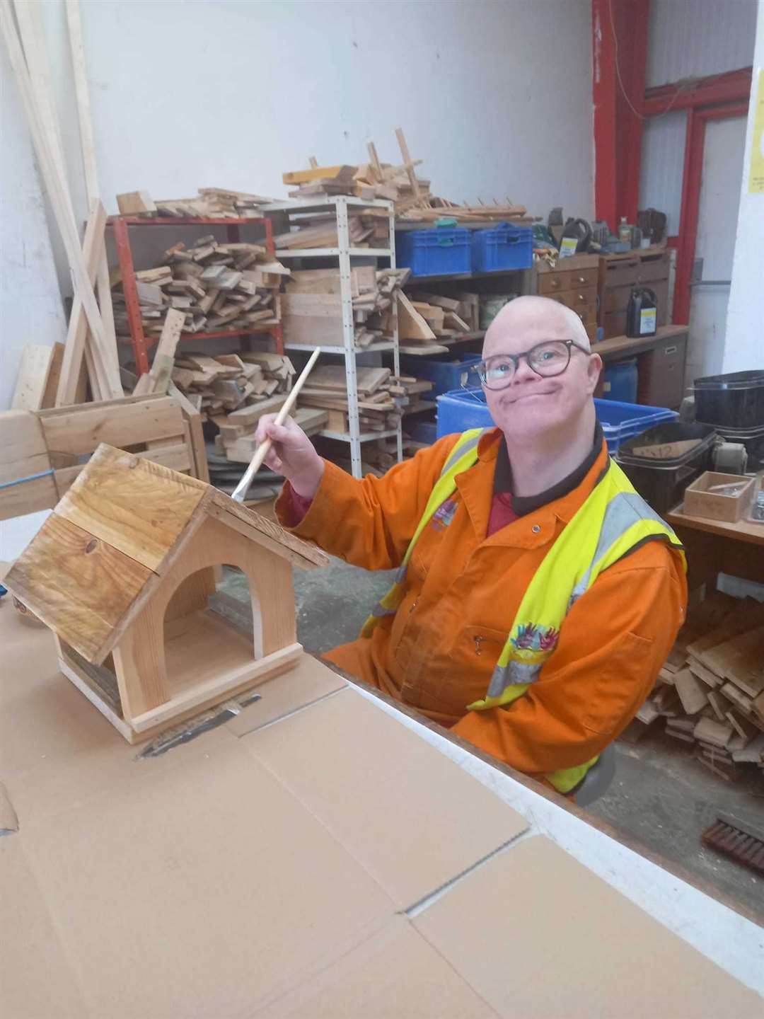 Varnishing a bird table ready for sale. Picture: MRO