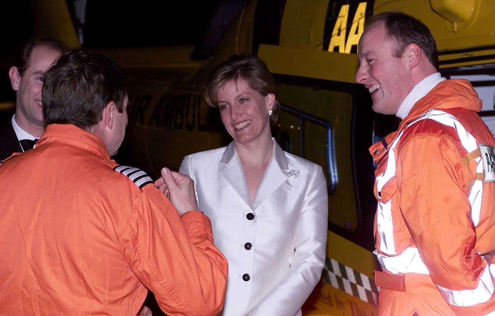 The Earl and Countess of Wessex in 2002 with TVAA helicopter pilot Andy Busby (left) and paramedic Tim Goddard, part of the crew who airlifted Sophie to hospital (Andrew Stuart/PA)