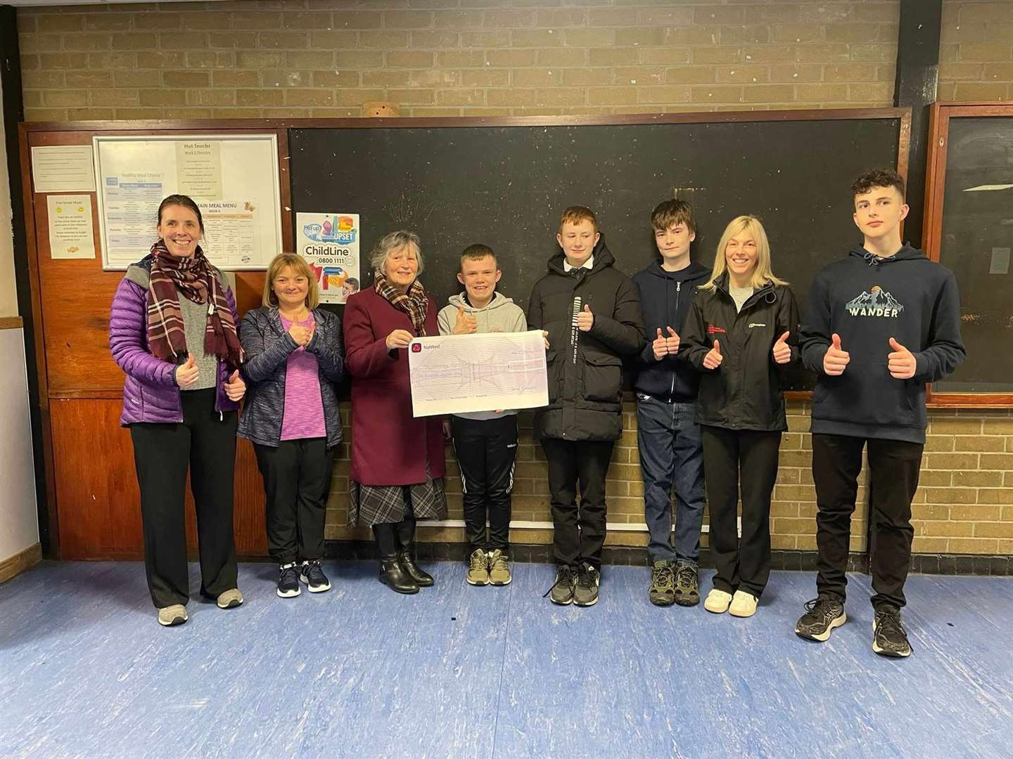 Volunteer Lorraine King, leader Lesley Mawhinney, Lorna Creswell, young leader Travis Bremner (13), Connor MacDonald (15), Joshua Smith (14), Active Schools coordinator Rosalyn Carruthers and young leader Austin Davies (14).