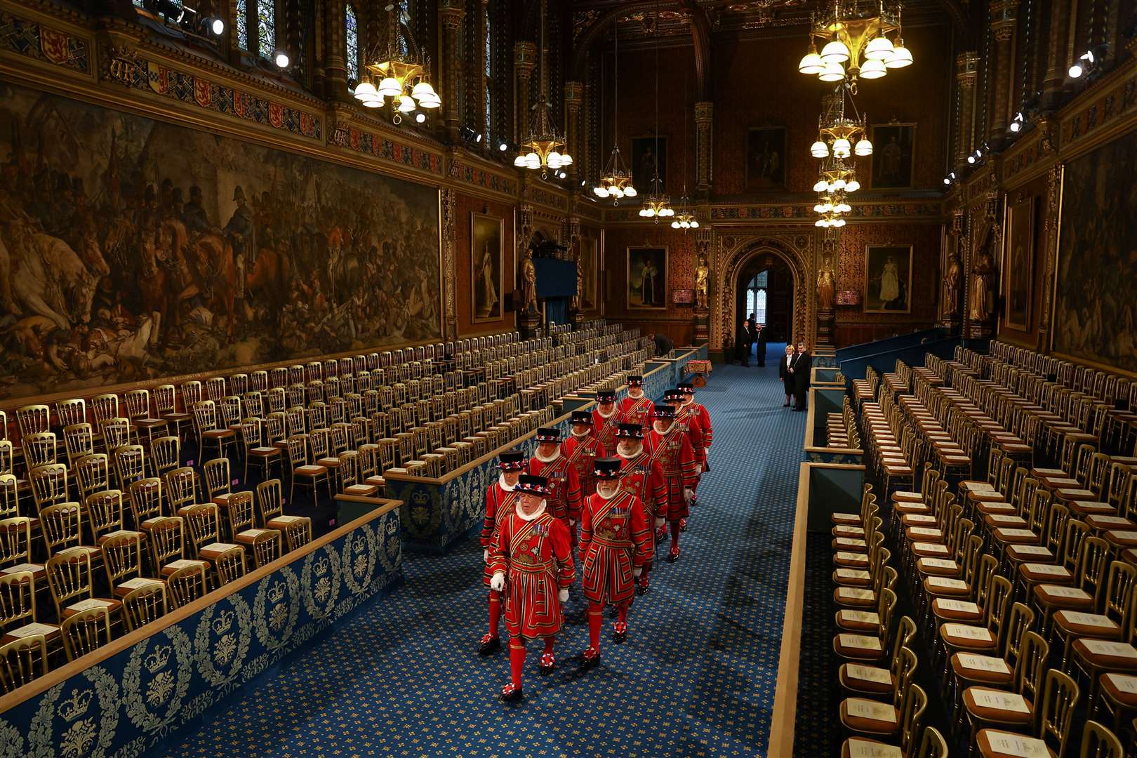 Yeomen of the Guard, wearing traditional uniform, walk through the Royal Gallery during the ceremonial search before the State Opening of Parliament in the House of Lords (Hannah McKay/PA)