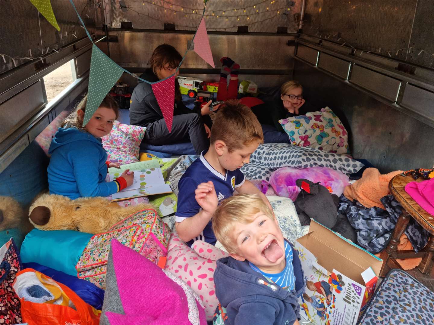 The children had blankets, pillows and games in the trailer.