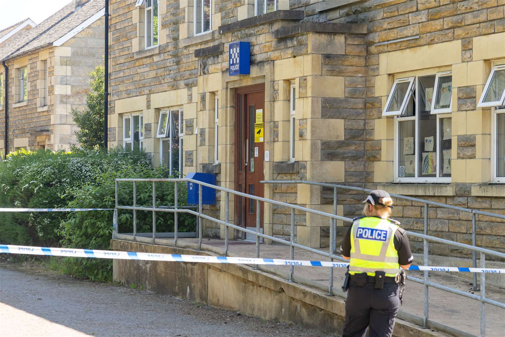 Blood is visible on the bannister and the door at Forres Police Station..Picture: Beth Taylor.