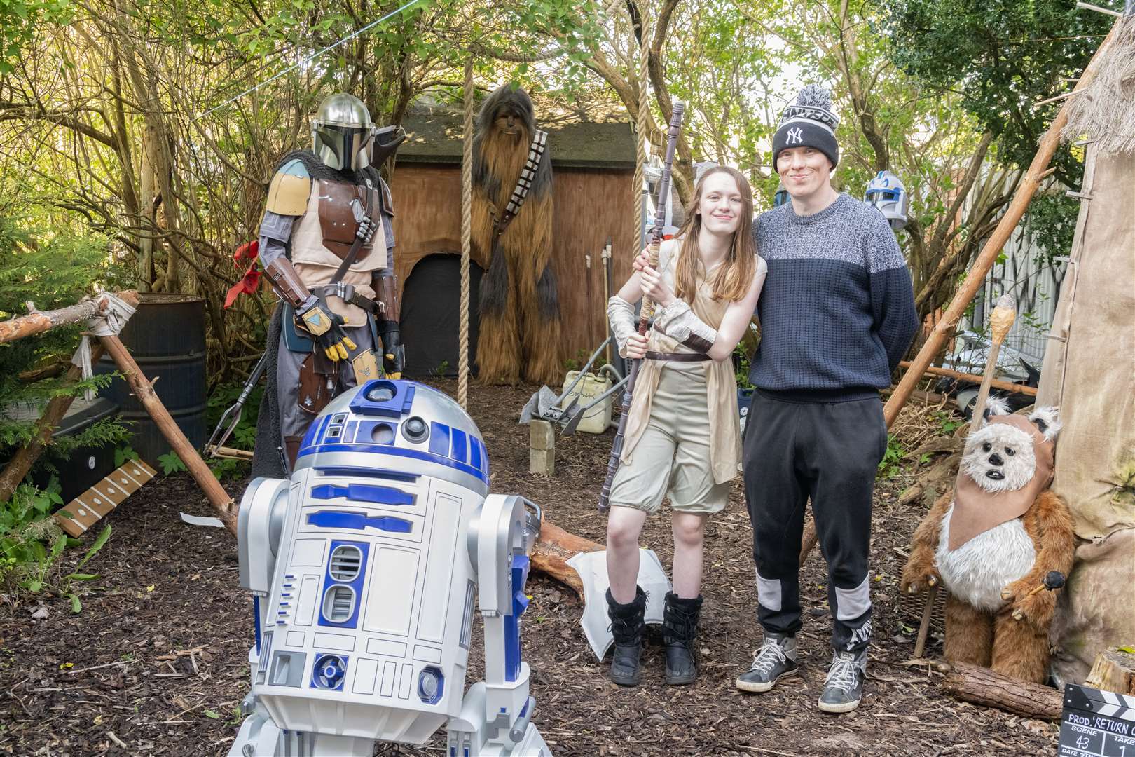 Creator Mark and his daughter and assistant Nicole with a few of the characters in the garden.