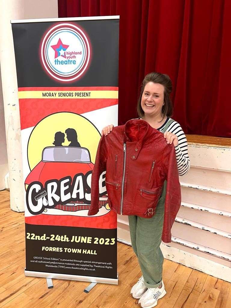 Gillian Murdoch of Highland Youth Theatre with one of the jackets donated for Grease.