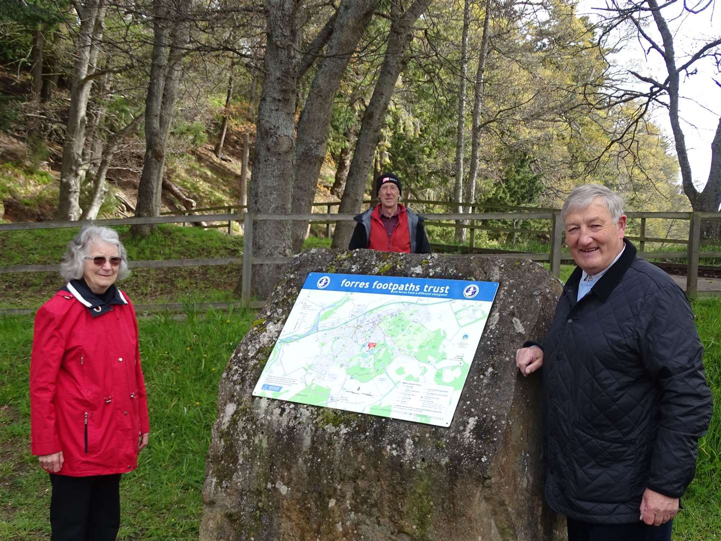 Forres Footpaths Trust members Dorothy Scott, David Binney and Wilson Metcalfe admiring one of the new map panels at Sanquhar car park.