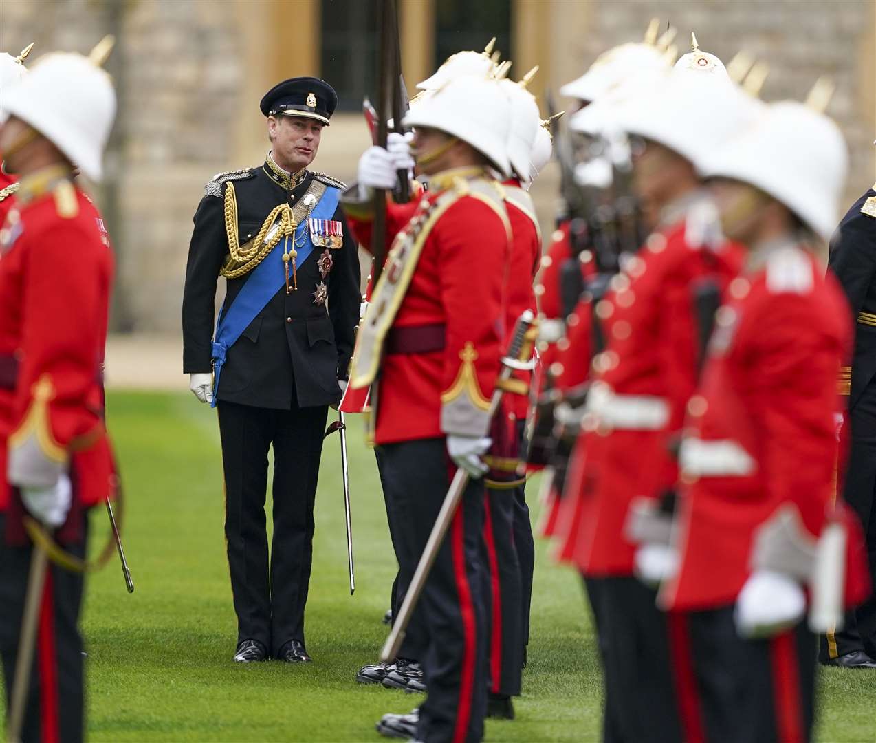 The Earl of Wessex presenting new colours to the Royal Gibraltar Regiment during a ceremony at Windsor Castle (Steve Parsons/PA)