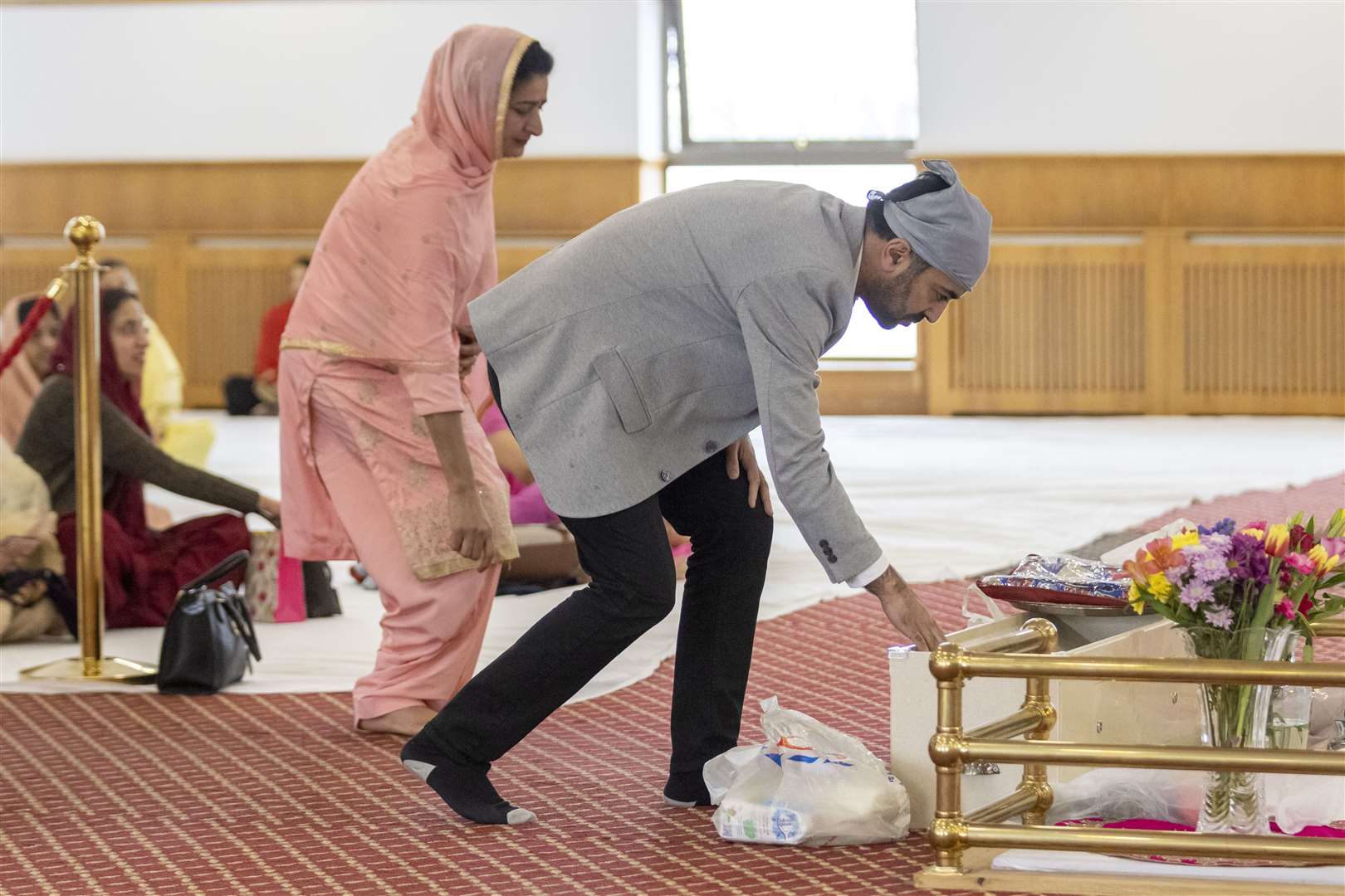 Humza Yousaf makes an offering at the gurdwara (Robert Perry/PA)