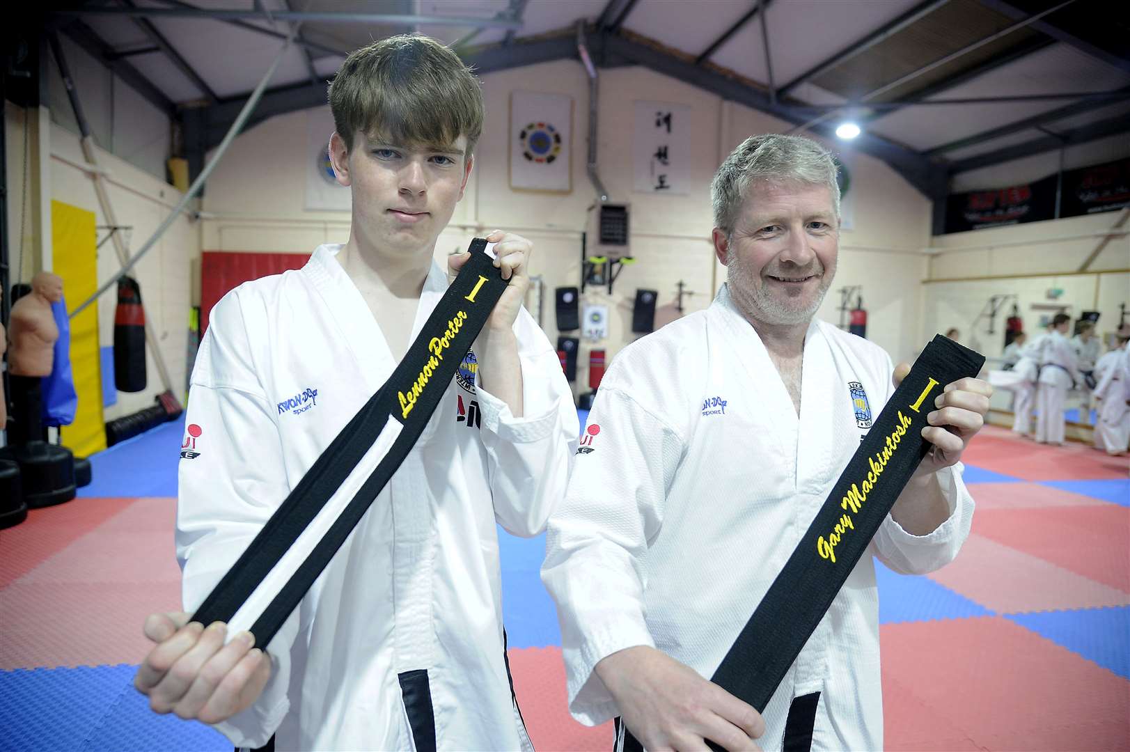 Lennon Porter and Gary Mackintosh who recently gained their black belts.