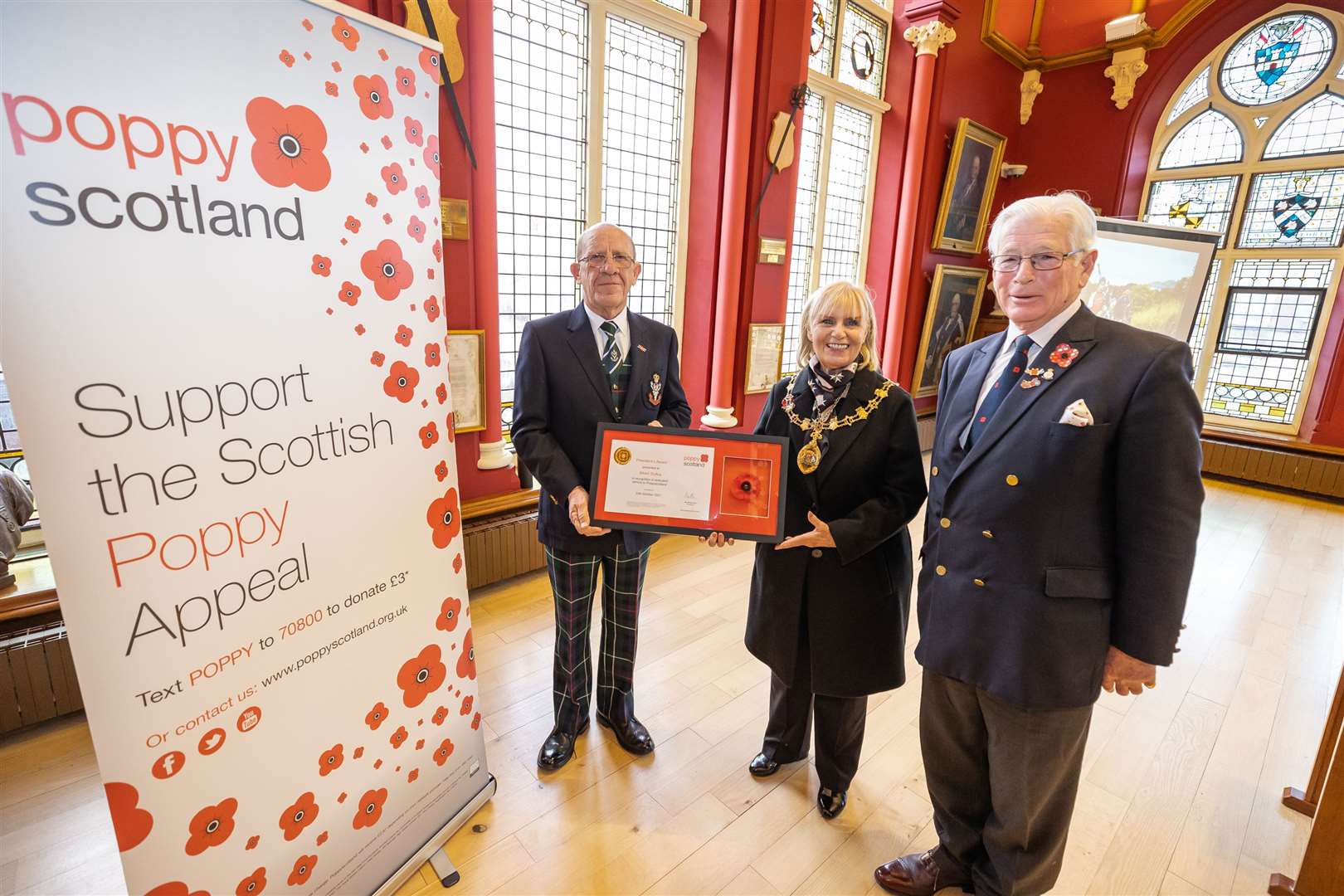 Albert Duffus (left)being presented with the President’s Award by Inverness Provost Helen Carmichael and Lieutenant General Sir Alistair Irwin.