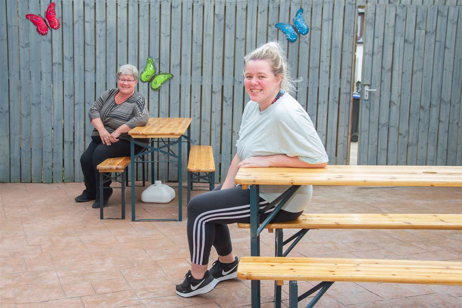 Joan Hay (Left) and Lauren McKandie (Right)...Volunteers at the Huntly & District Ex-Servicemens Club have transformed an area into a beer garden to help comply with new coronavirus restrictions. ..Picture: Daniel Forsyth..