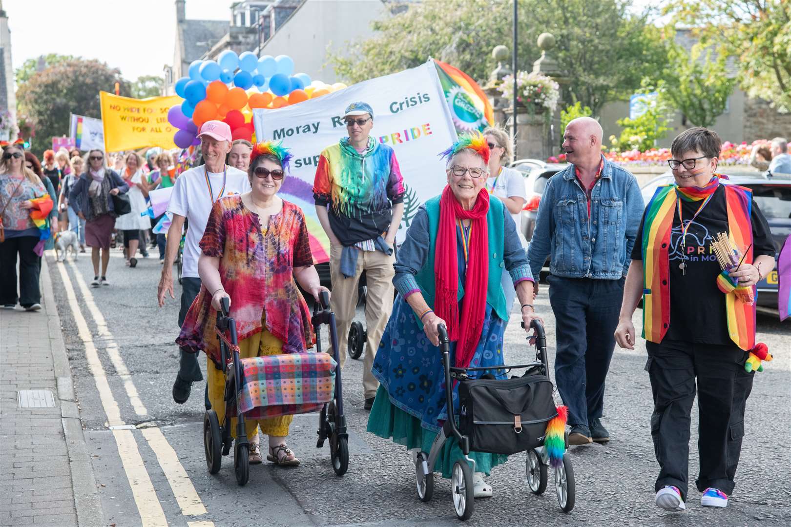 Pride in Moray 2023 marchers of all ages on High Street. Picture: Daniel Forsyth