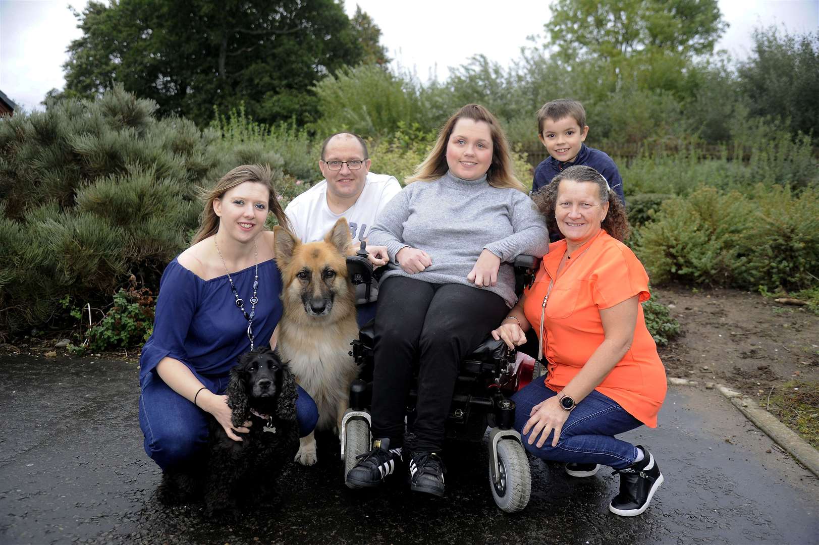 Carly and Gavin McConnachie, Chloe O’Hare, Gavin’s son Cameron and Brenda Macdonald, with their dogs Poppy and Gucci.