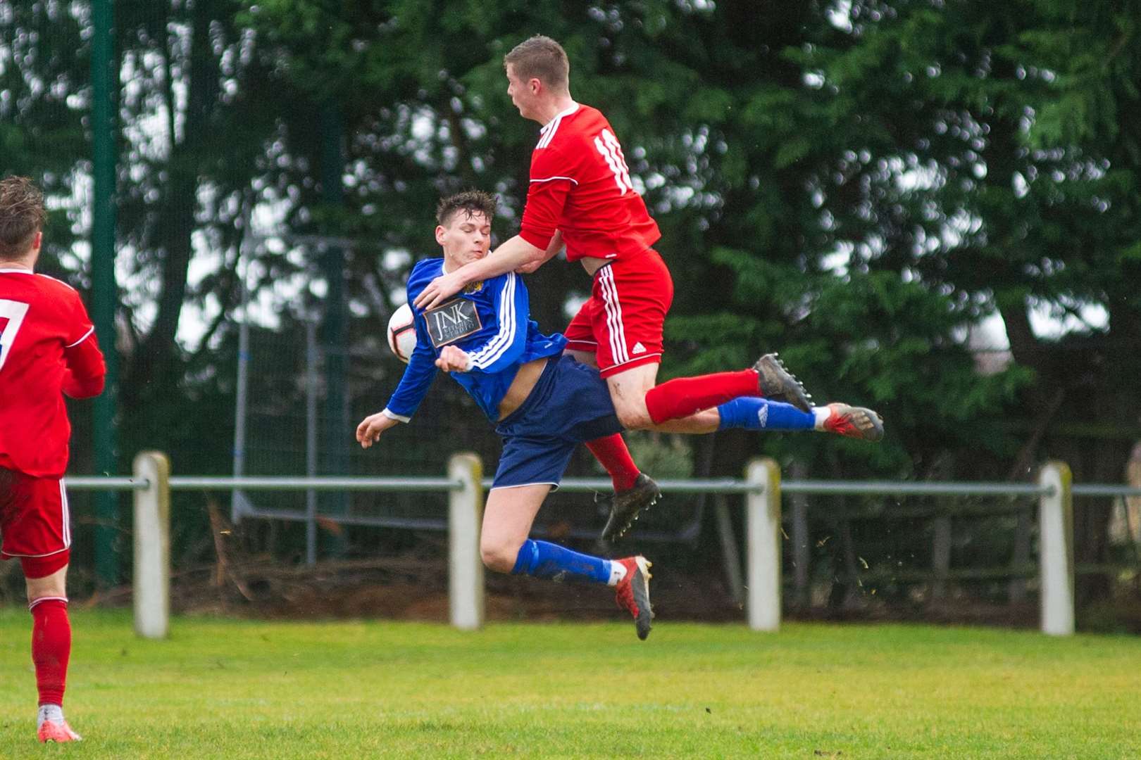 Brandon Hutcheson rises to win a header against Burghead's Jared Kennedy, now of Lossiemouth. Picture: Daniel Forsyth