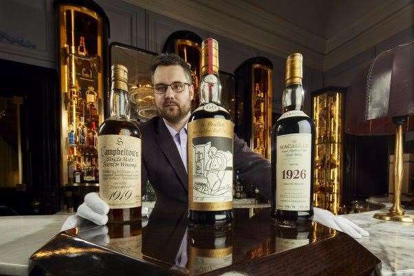 Whisky Auctioneer founder Iain McClune, at The Gleneagles Hotel American Bar, with some of the highlights from Richard Gooding's collection.