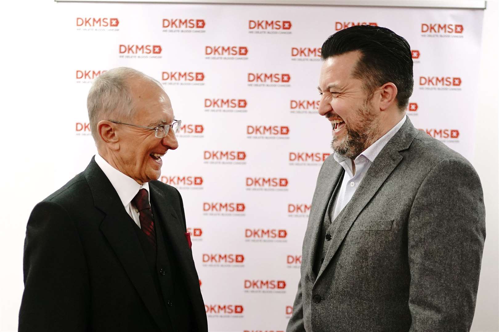 Ivor Godfrey-Davis (left) with his blood stem cell donor Mark Jones as they meet for the first time after the life-saving donation, at the offices of DKMS in London (Victoria Jones/PA)