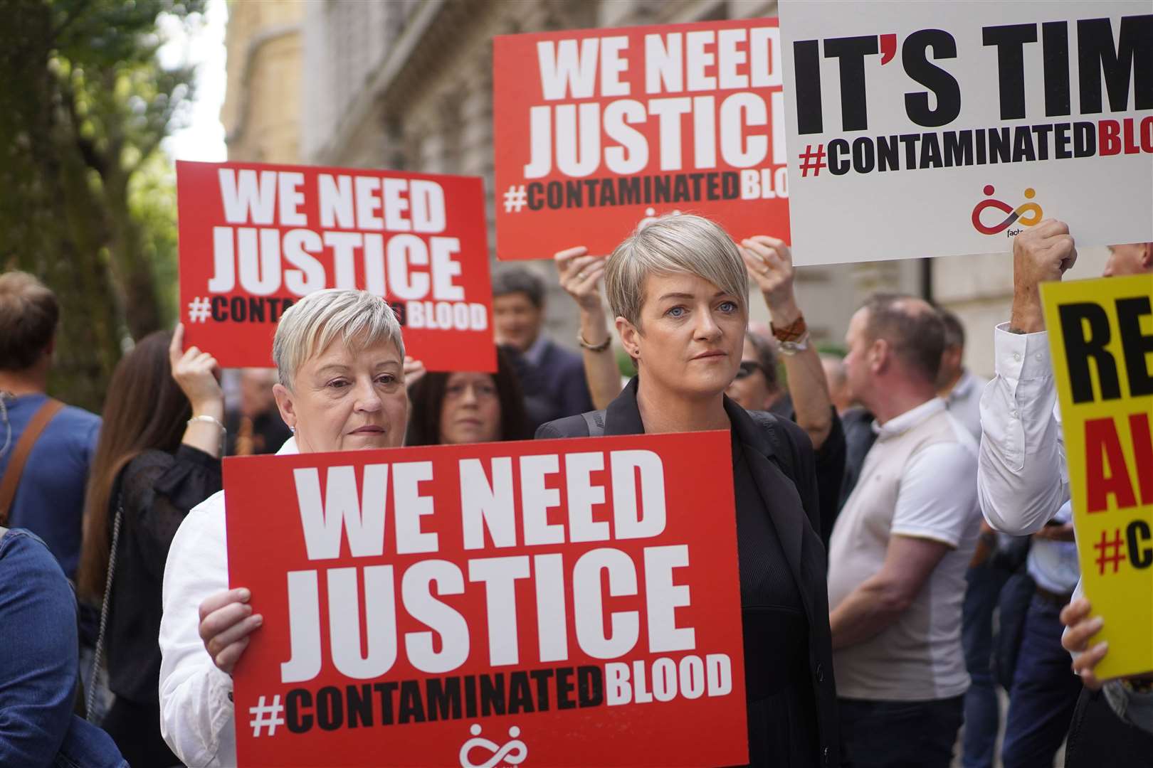 Campaigners, including many who are personally infected and affected by infected blood, gather in Westminster, London, calling for compensation for victims (Victoria Jones/PA)