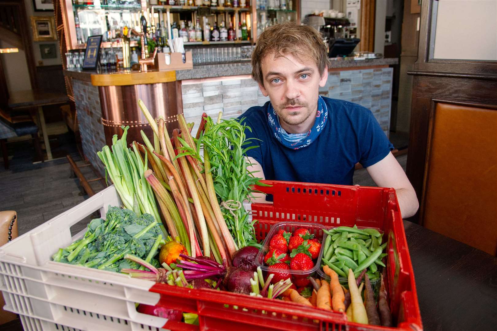 Head chef Henry with locally grown fruit and vegatables.