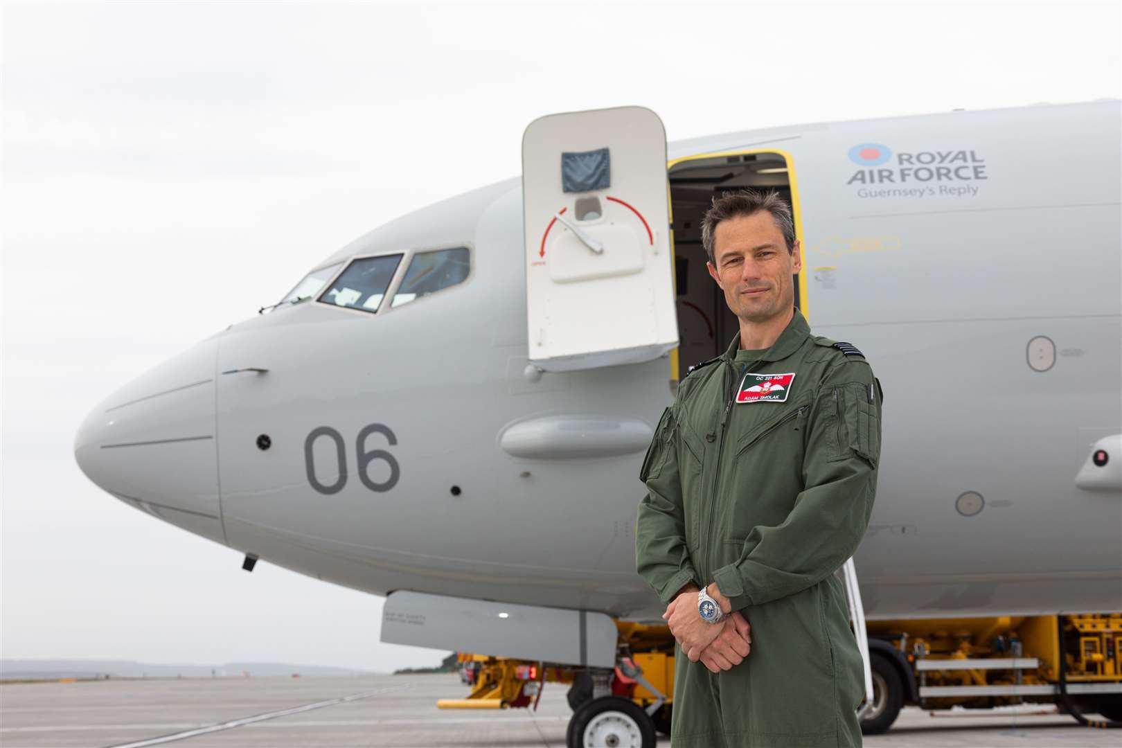 Wing Commander Adam Smolak, Officer Commanding 201 Squadron, in front of the newest aircraft to arrive at RAF Lossimeouth, Guernsey's Reply.