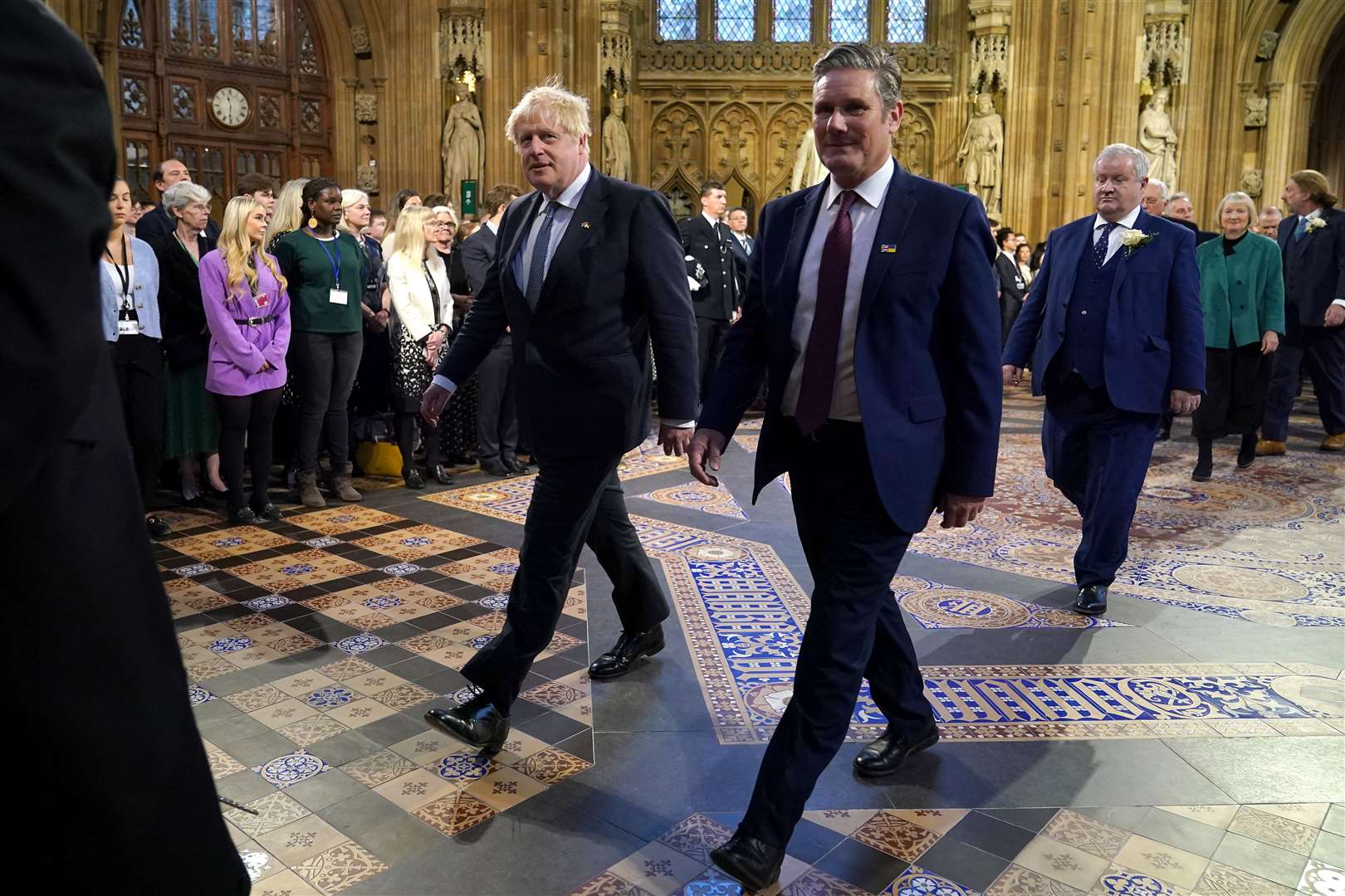 Prime Minister Boris Johnson and Labour Party leader Sir Keir Starmer walk through the Central Lobby at the Palace of Westminster ahead of the State Opening of Parliament (Yui Mok/PA)