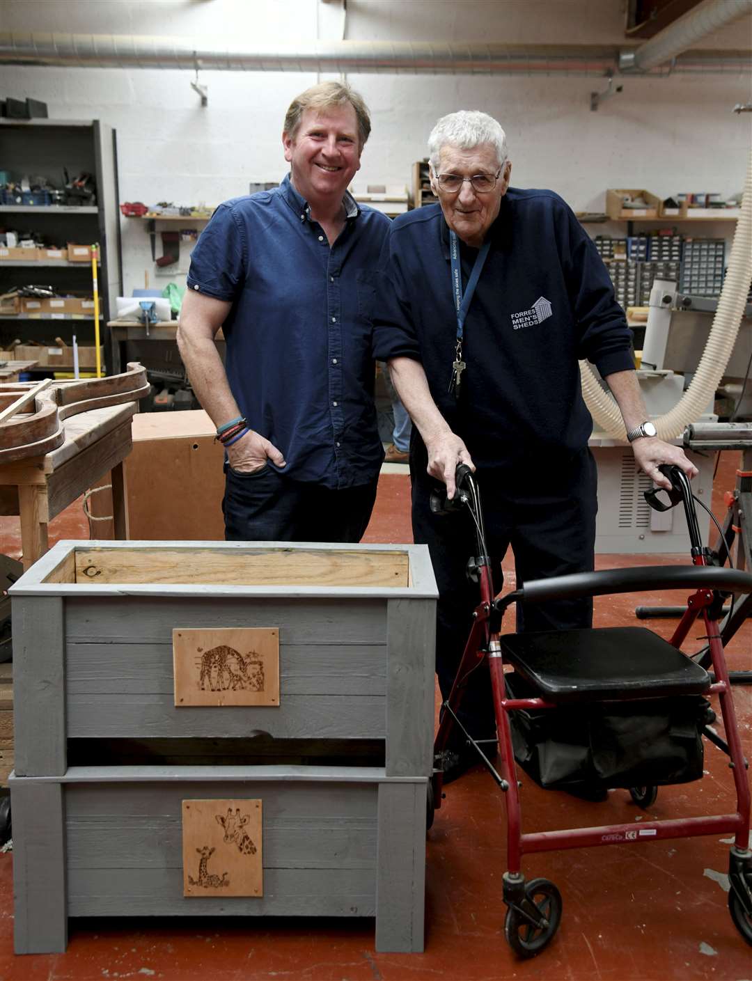 Davie Bell (right) showing Euan Martin some grow boxes he has been working on. Picture: Beth Taylor