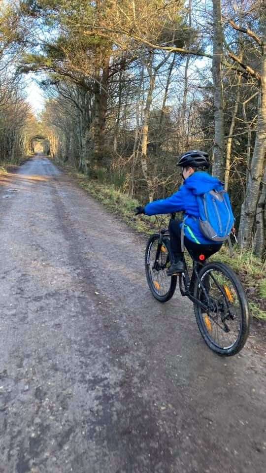 Hopeman Primary School pupil Rohan Scott gets on his bike for Outfit Moray's Winter Challenge.
