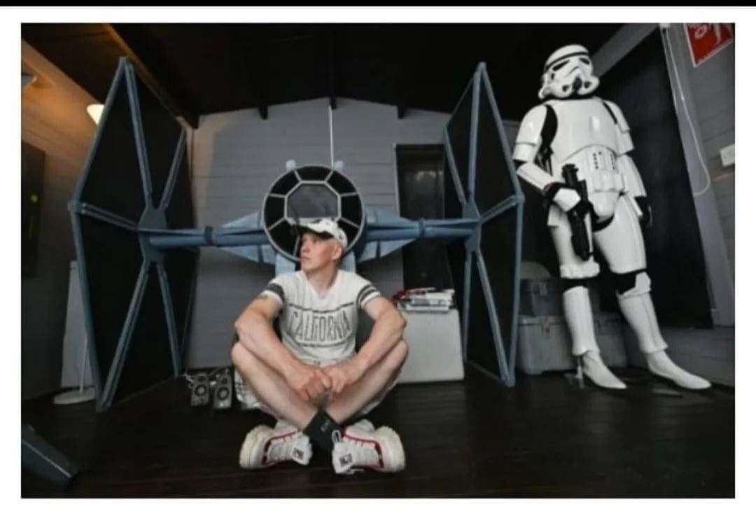 Mark at home with his Tie Fighter model and a Stormtrooper.