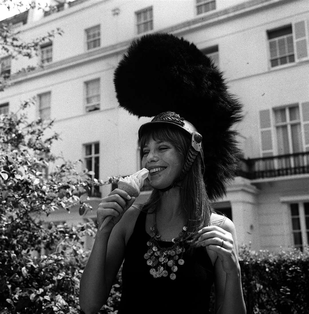 Actress and model Jane Birkin keeps cool with an ice cream in 1970 (PA)