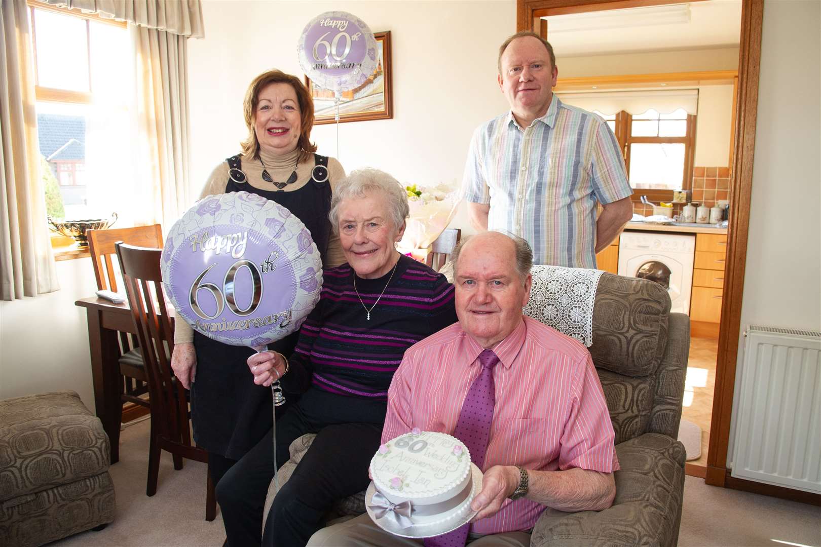 Ian and Isobel are joined by their son and daughter-in-law Kelvin and Maureen Christie...Ian and Isobel Christie, orginally from Brora, celebrate 60 years of married life at the house in Forres. ..Picture: Daniel Forsyth..