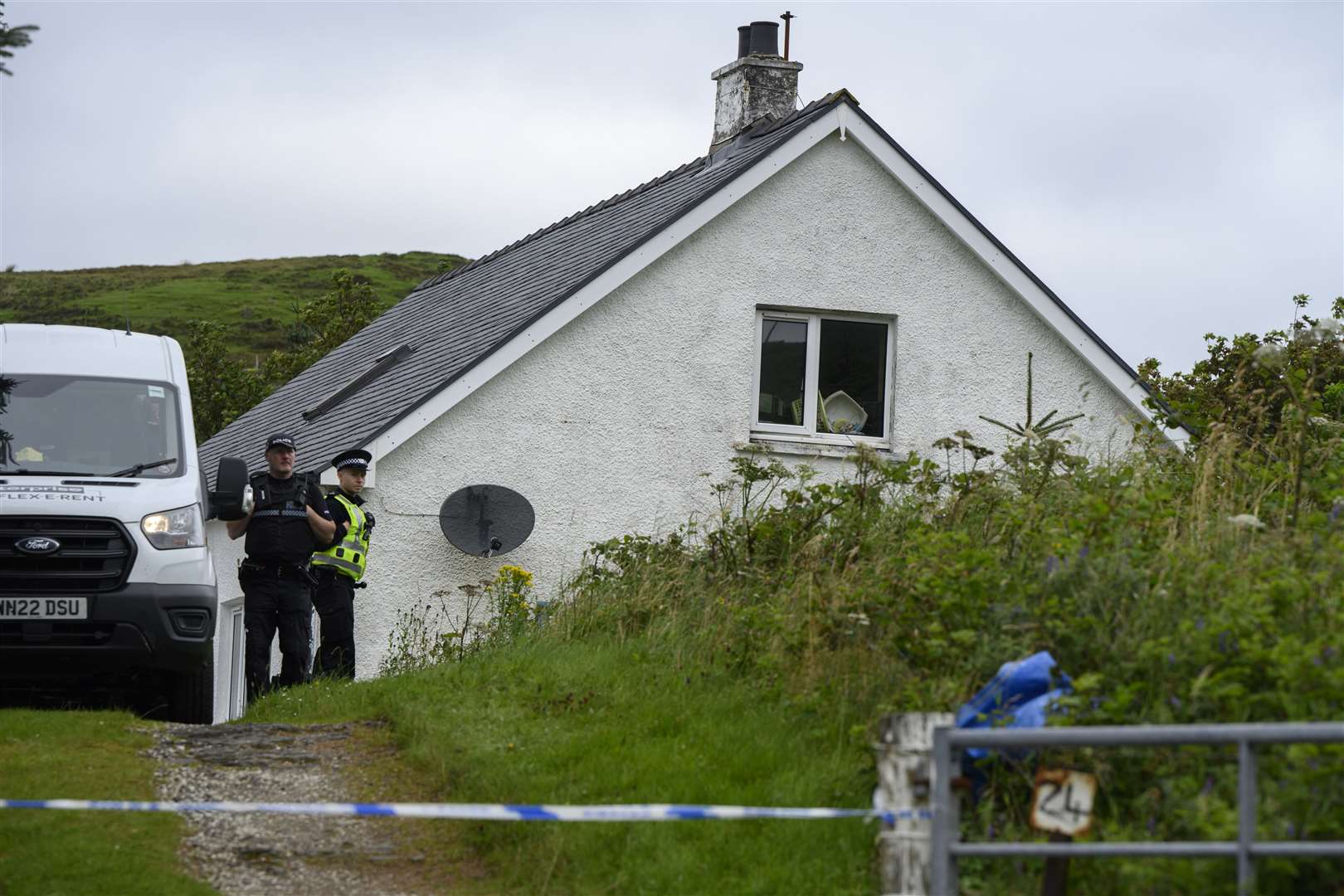 Police officers secure the scene of an incident at Tarskavaig, Skye (John Linton/PA)