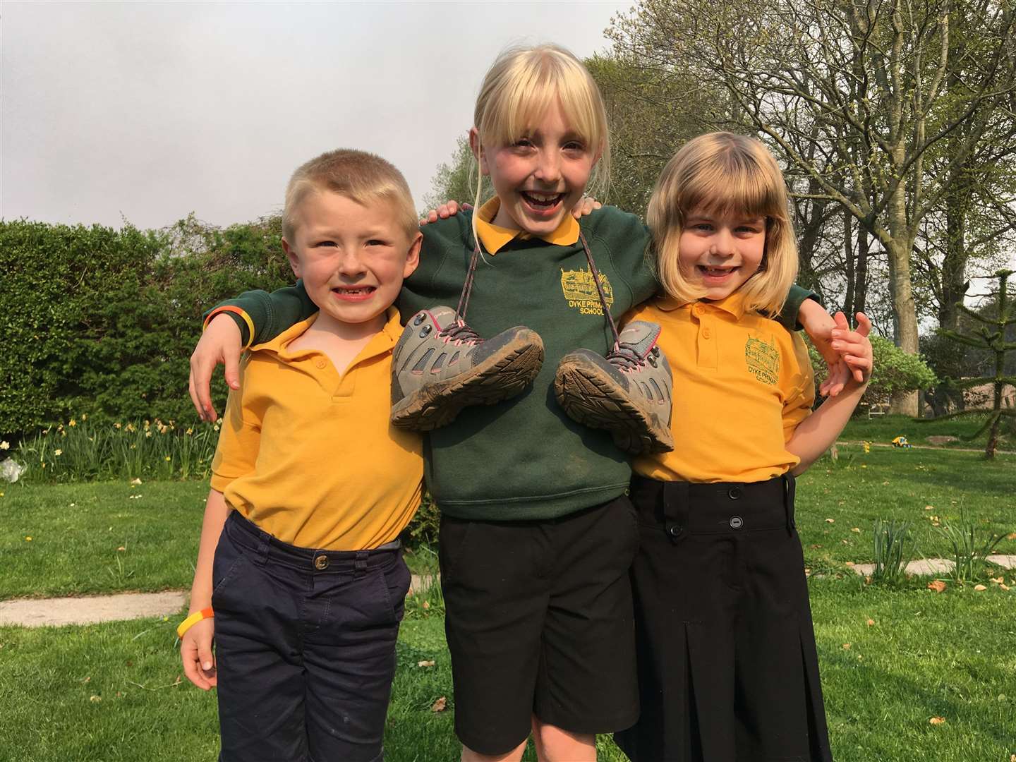 Keira (centre) with her brother Callum and cousin Emilia is raising money for two charities close to her heart.