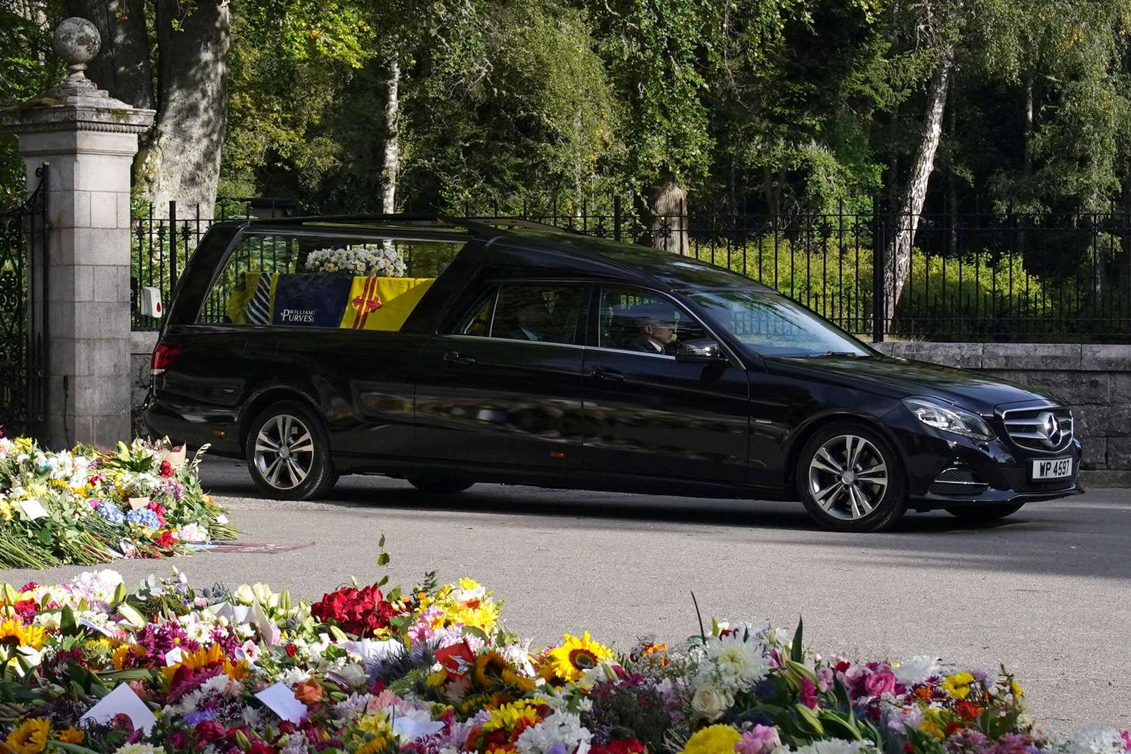 The hearse carrying the coffin of Queen Elizabeth II left Balmoral on Sunday morning (Owen Humphreys/PA)
