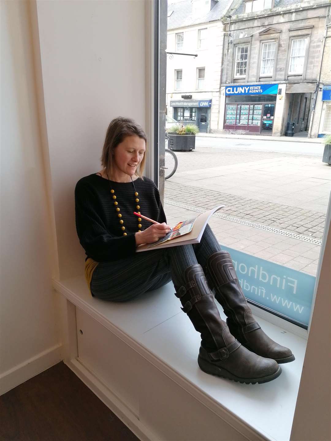 Caroline working from Forres High Street before lockdown.