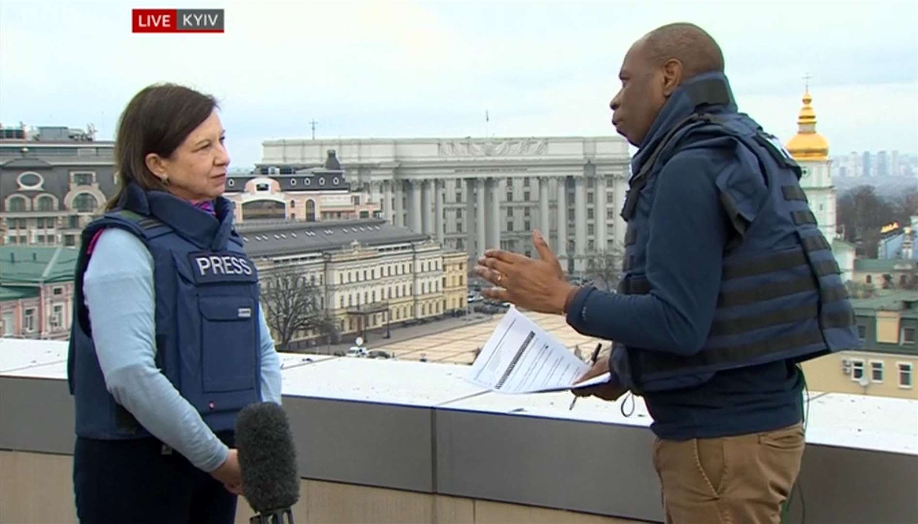 Clive Myrie and Lyse Doucet wearing flak jackets during a broadcast from Kyiv in Ukraine (BBC)