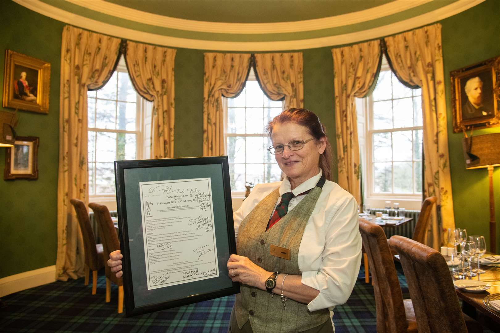 Karen Hussain of Durn House, Portsoy, with a signed menu from the cast and crew after they stayed at the house last year during filming...Picture: Daniel Forsyth..