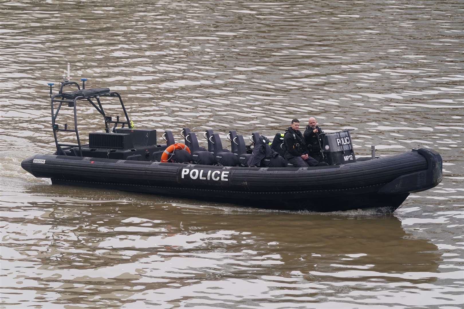 Members of the Metropolitan Police Marine Policing Unit searching for Ezedi (Lucy North/PA)