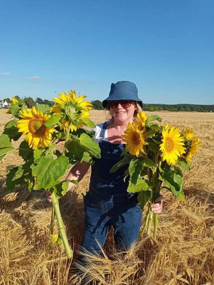 A visitor with her sunflower bunches at Byres Farm.