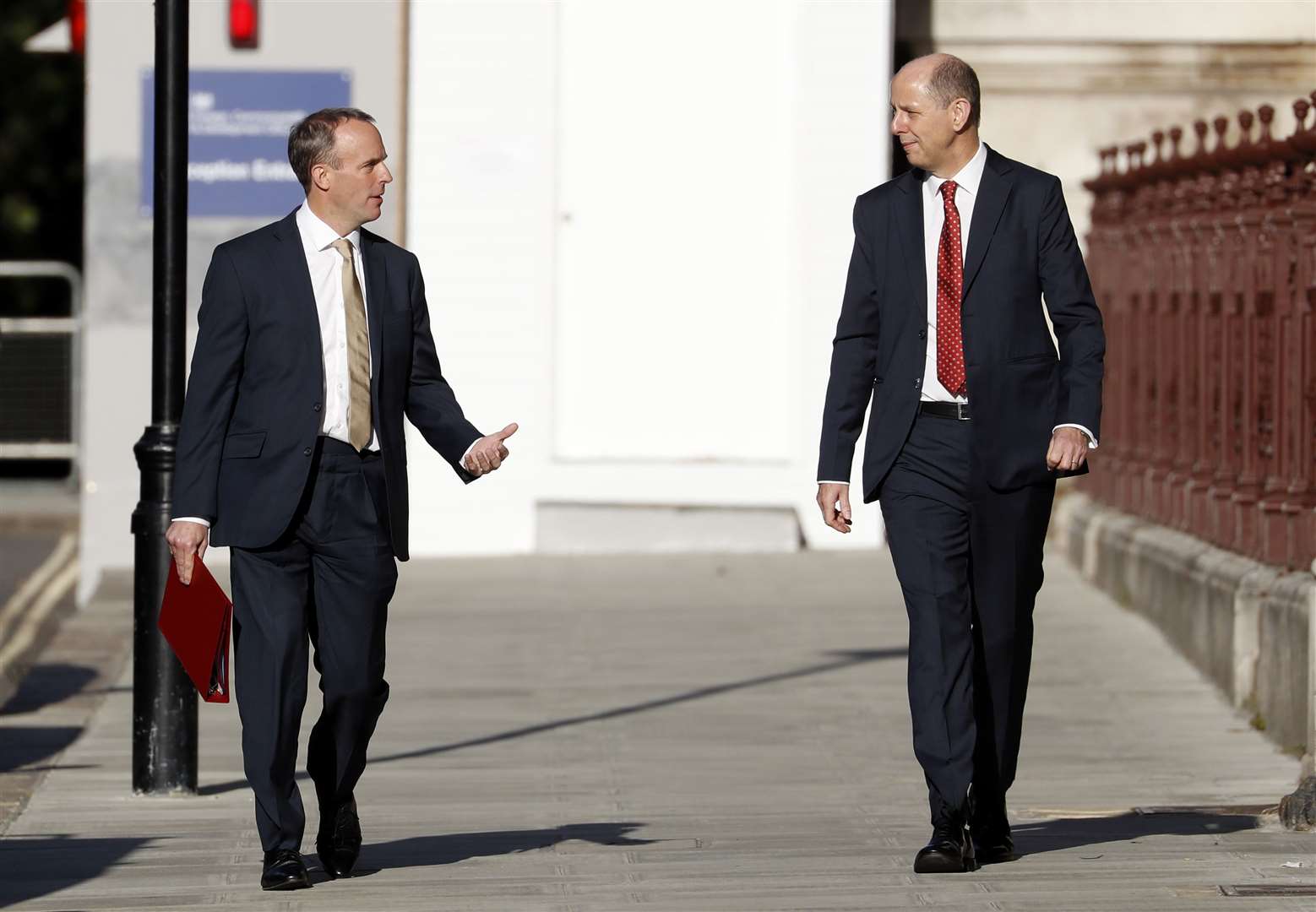 Foreign Secretary Dominic Raab and Permanent Under Secretary Philip Barton arrive at the newly named Foreign, Commonwealth and Development office in King Charles Street, Westminster (Alastair Grant/PA)