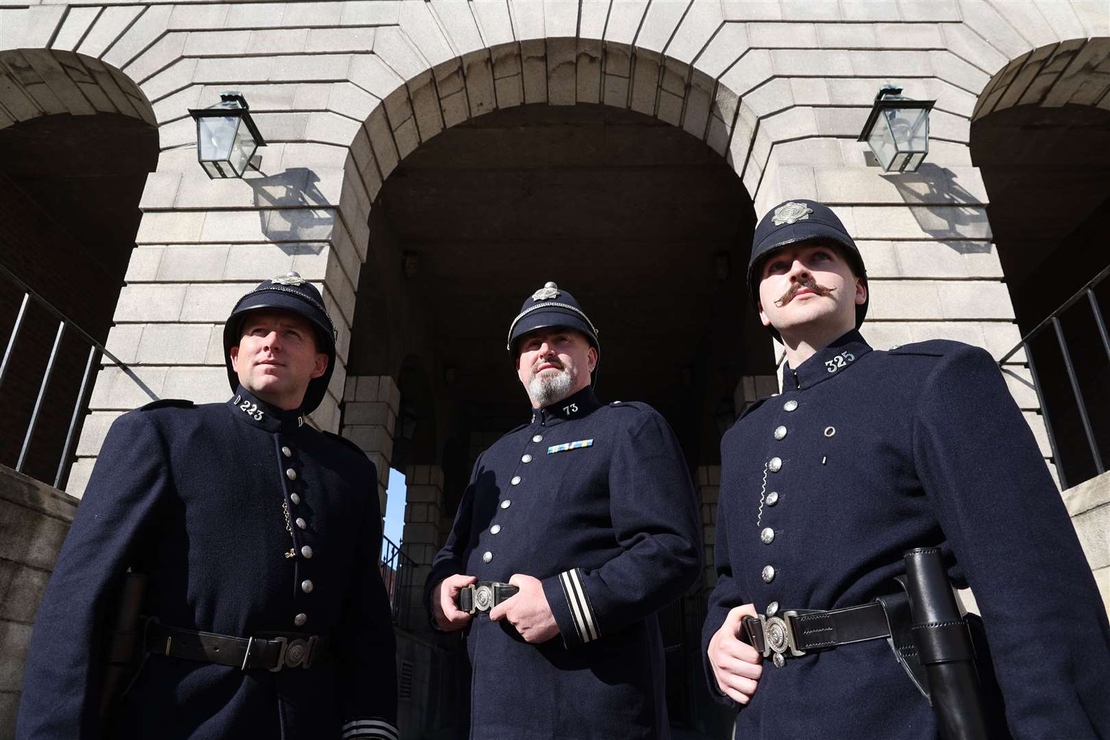 Matthew Gargan, left to right, Tom Daly and Emmet Harte in original Garda uniform during a parade in Dublin to mark the anniversary of the transfer of policing duties from British rule 100 years ago (Nick Bradshaw/PA)