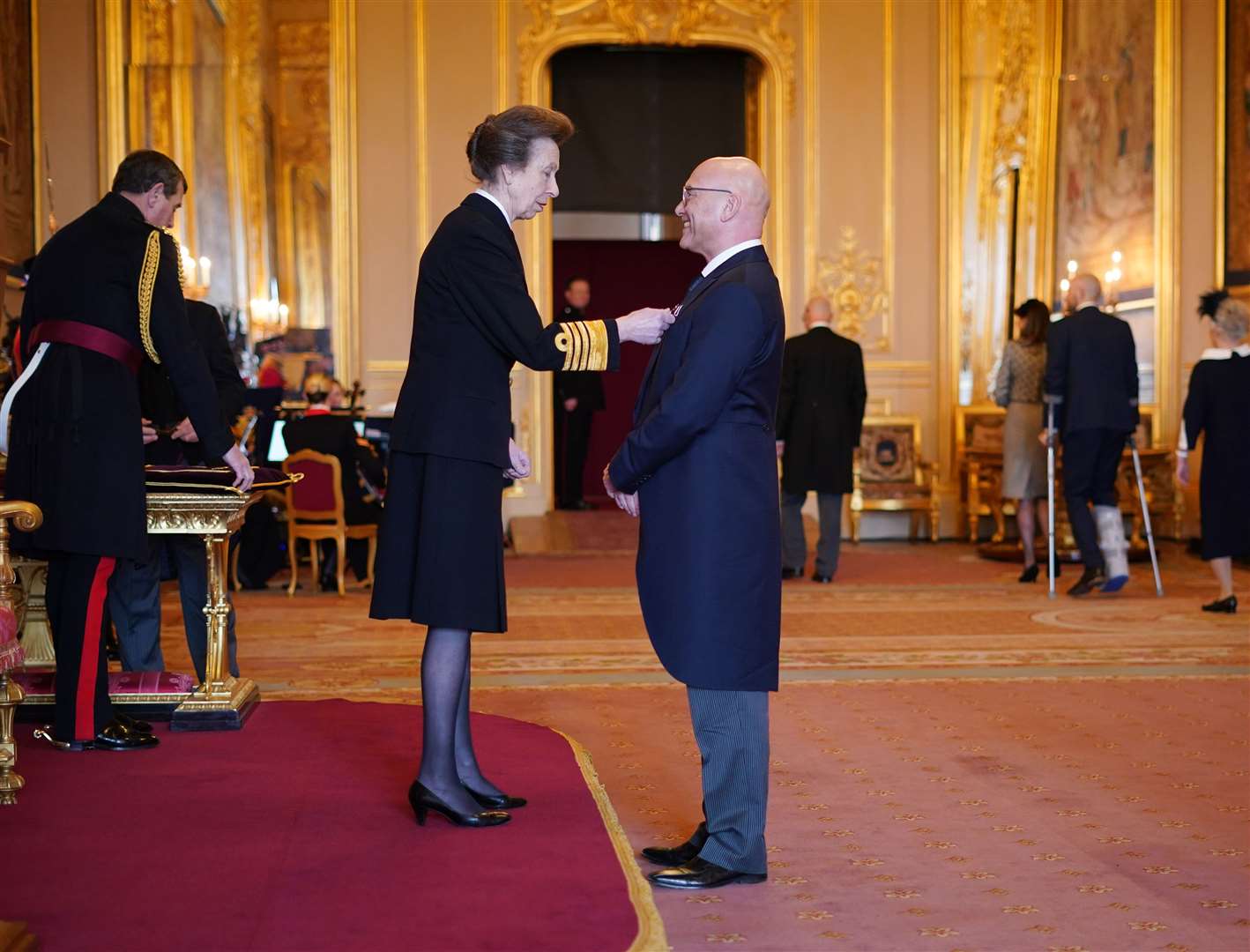Gregg Wallace speaks to the Princess Royal as he is made an MBE (Yui Mok/PA)