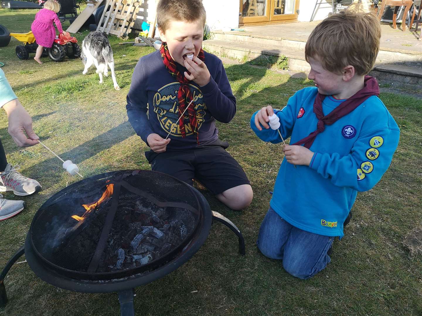 Euan (12) and Beaver brother Calum (7) Gray toasting marshmallows.