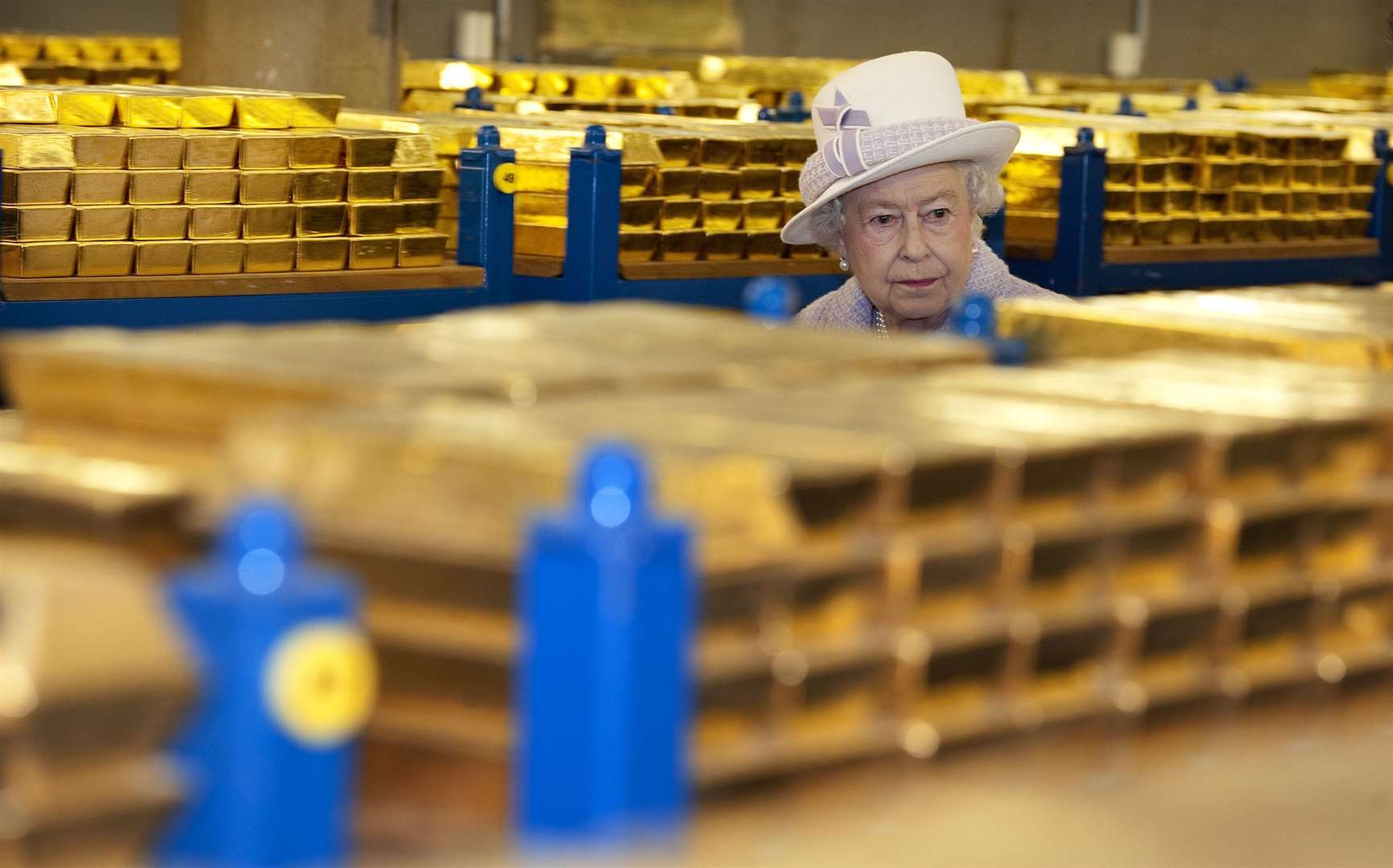 Queen Elizabeth II tours the gold vault during her visit to the Bank of England in 2012 (Eddie Mulholland/Daily Telegraph/PA)
