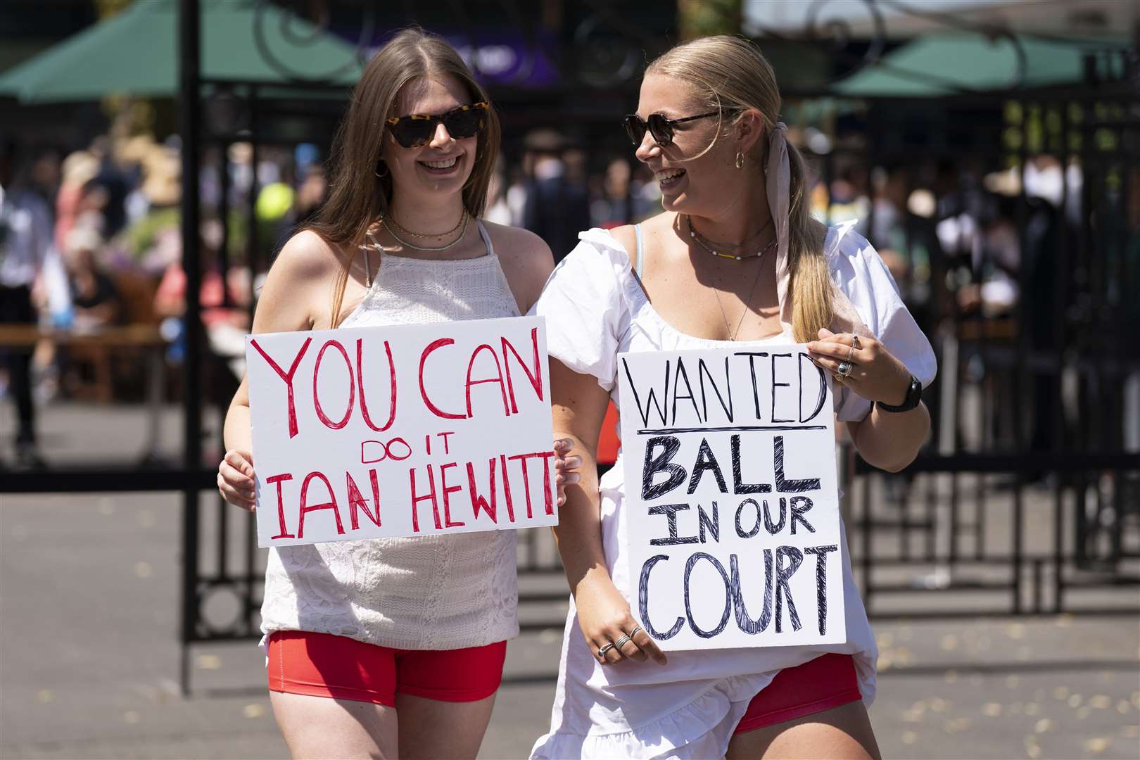 Campaigners from Address The Dress Code outside the main gate at Wimbledon (Kirsty O’Connor/PA)