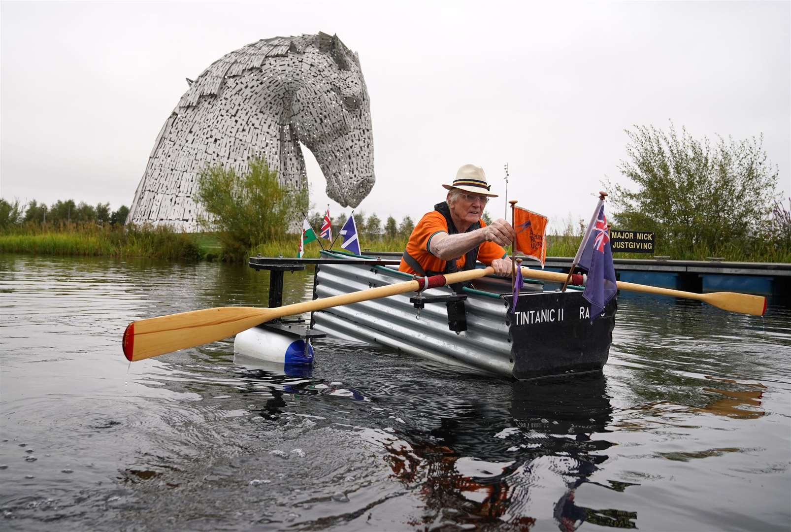 Retired Army major ‘Major Mick’ Michael Stanley rows Tintanic II along the Forth and Clyde Canal as part of his fundraising challenge (Andrew Milligan/PA)