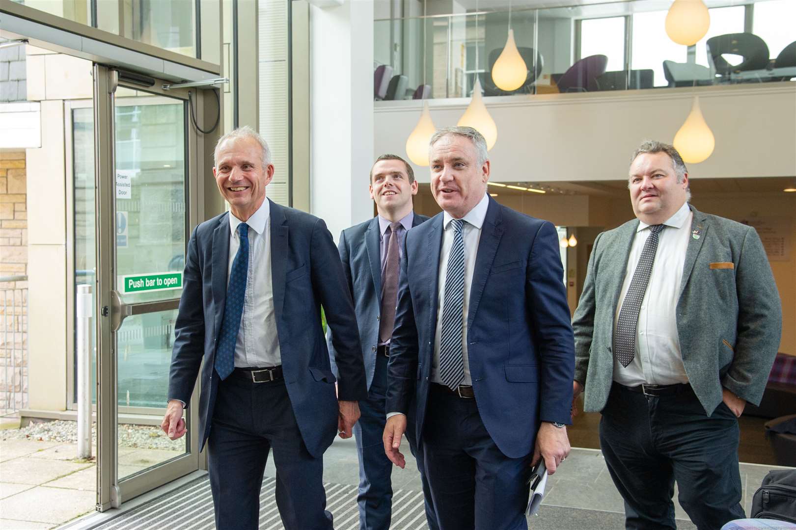 David Lidington, Douglas Ross MP, Richard Lochhead MSP, and Moray Council leader Graham Leadbitter after the UK and Scottish Governments pledged their support last July.