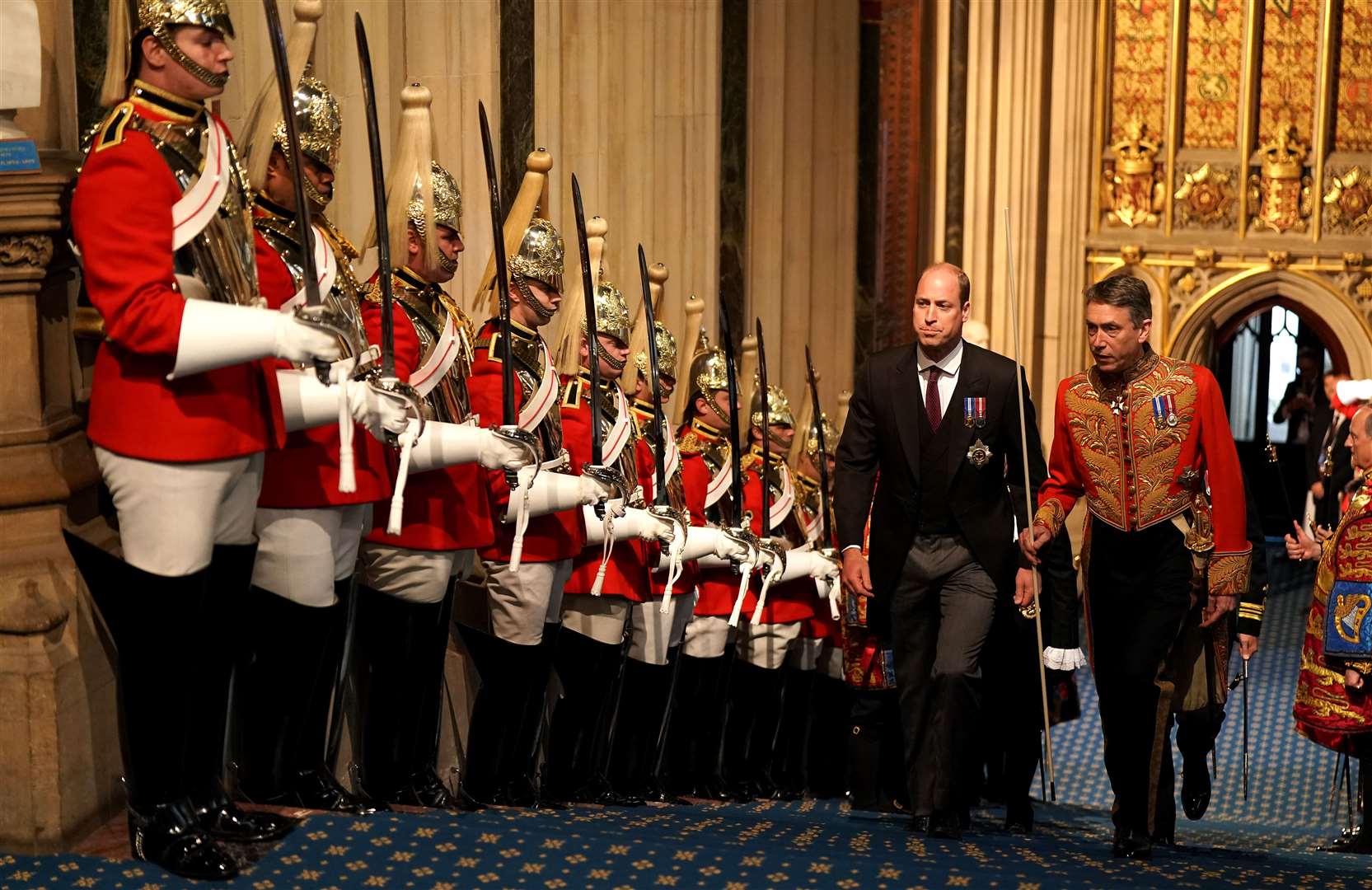 The Duke of Cambridge walks past the Household Cavalry in the Norman Porch at the Palace of Westminster (Aaron Chown/PA)